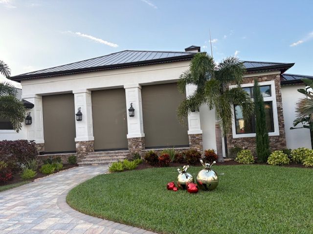 A Central Florida estate home with three motorized screens lowered