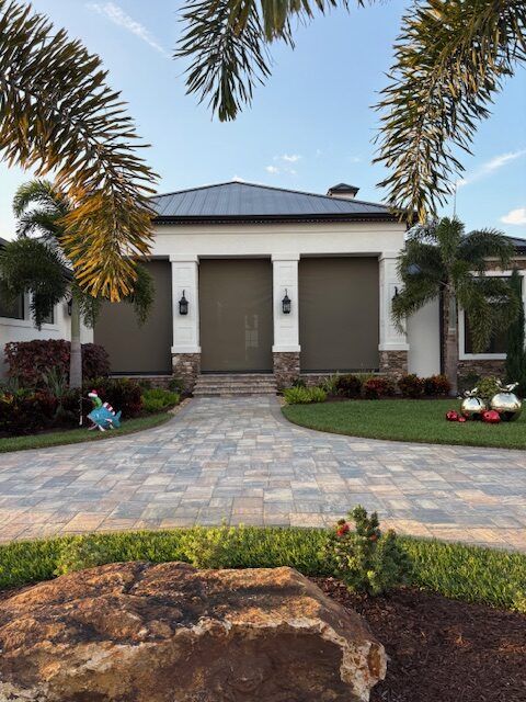 The same estate home from the paver driveway